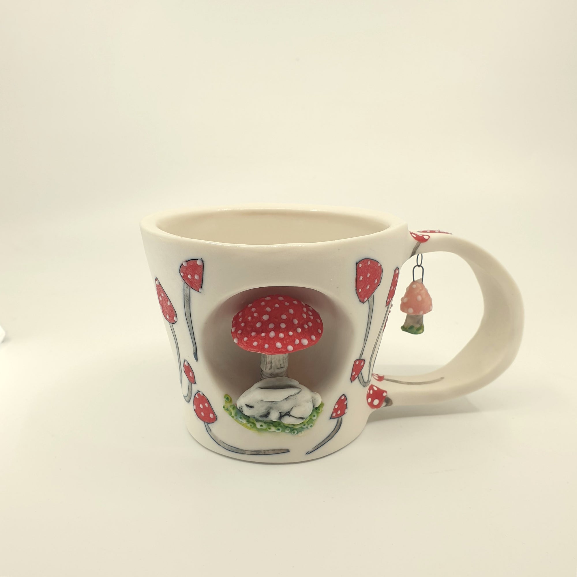 Porcelain bunny cup with red mushrooms
