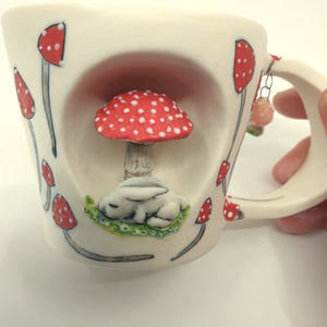 Porcelain bunny cup with red mushrooms