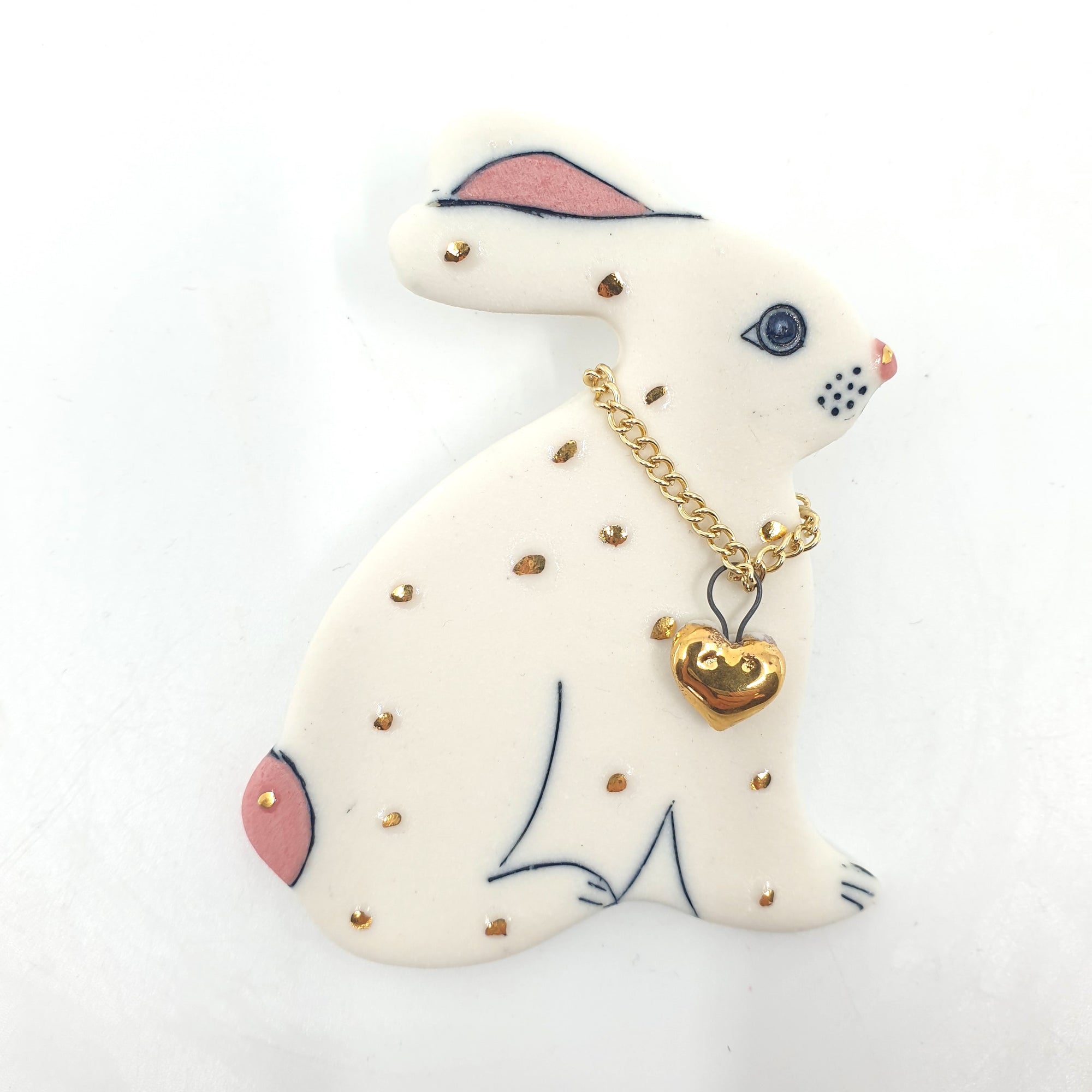 Rabbit with gold heart brooch