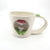 Porcelain cup with red mushroom