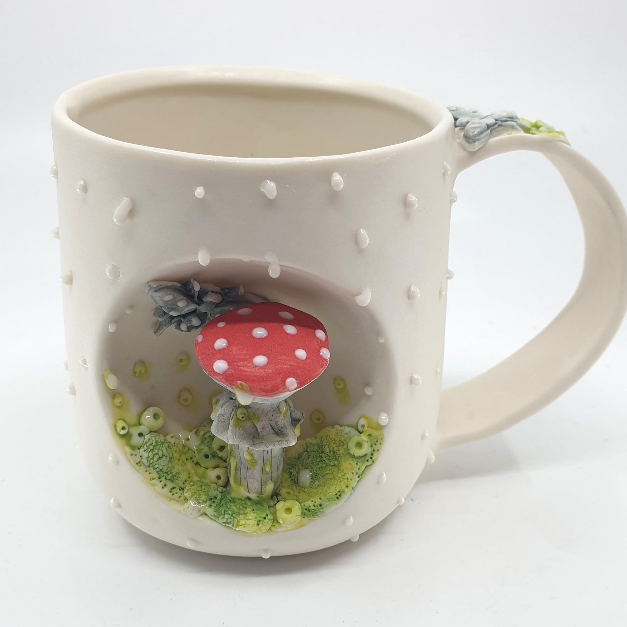 Porcelain mug with red mushroom and bee