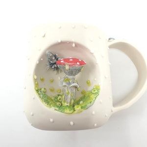 Porcelain mug with red mushroom and bee