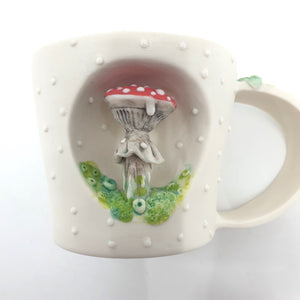 Porcelain cup with red mushroom