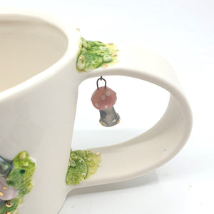 Porcelain cup with pink mushrooms and gold lustre