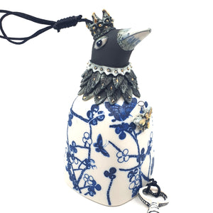 Bird bell with blue flowers and butterflies