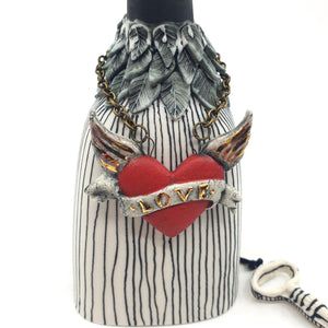 Bird bell with red flying heart