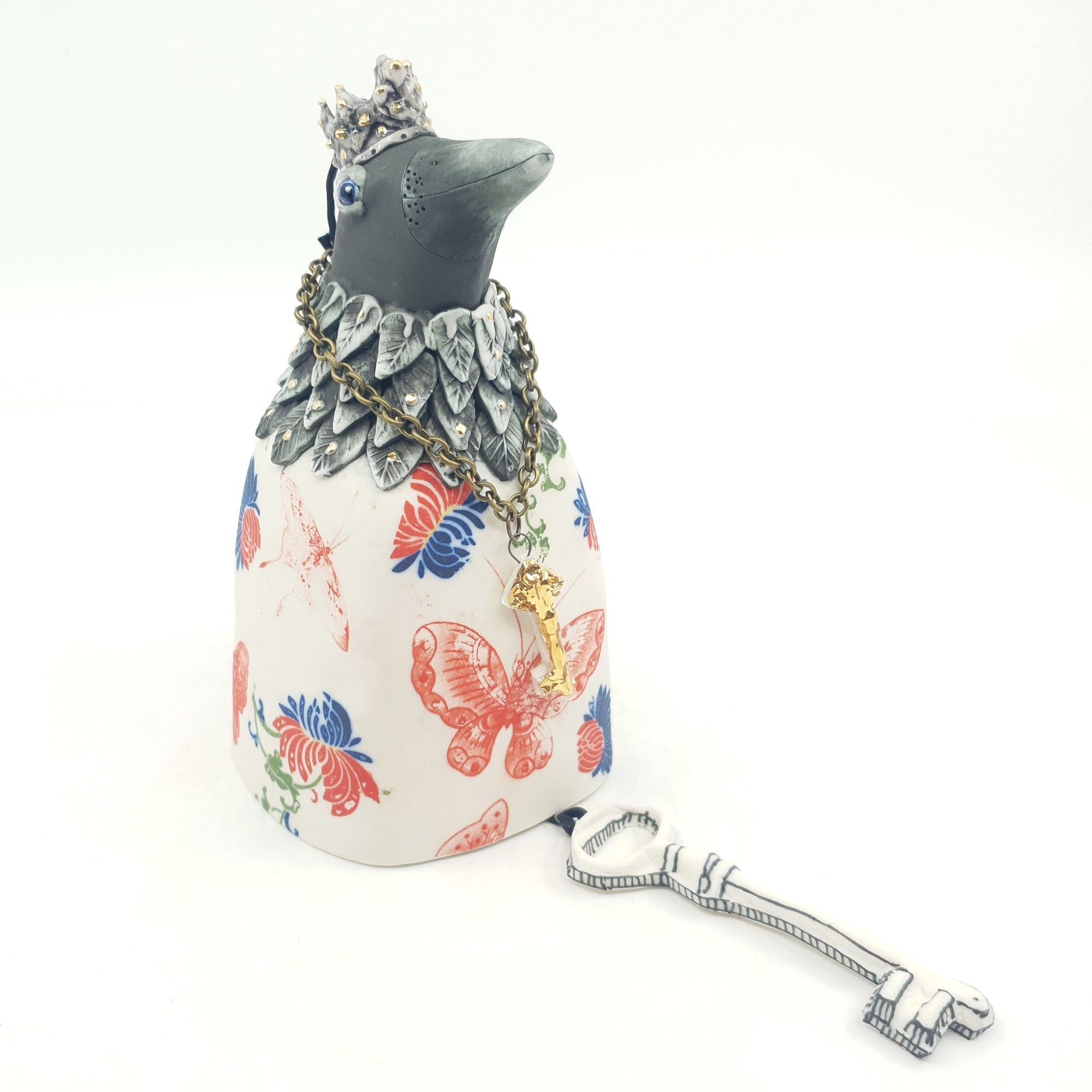 Bird bell with red and blue flowers, red butterflies and gold accents