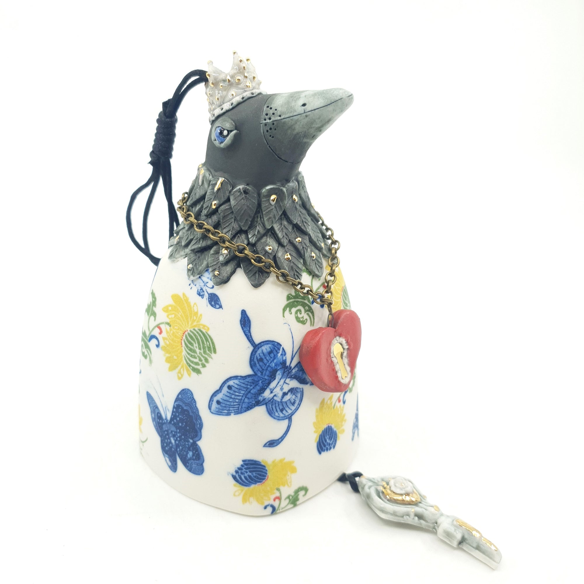 Bird bell with yellow flowers, blue butterflies and gold accents