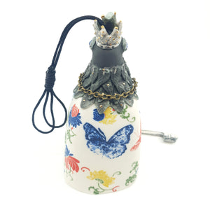 Bird bell with red and blue butterflies and gold accents