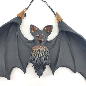 Flying bat (black with copper accents)
