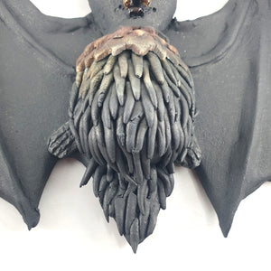 Flying bat (black with copper accents)