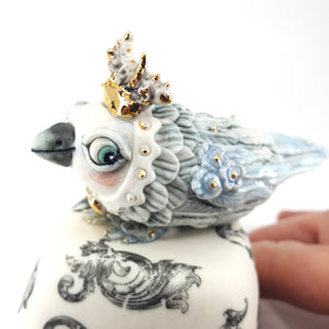 Baby Bird on scroll stand (pale blue bird and black and white stand)