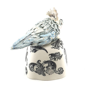 Baby Bird on scroll stand (pale blue bird and black and white stand)