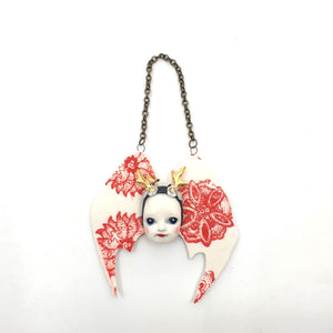 Hanging bat girl (red and white flowers and gold antlers